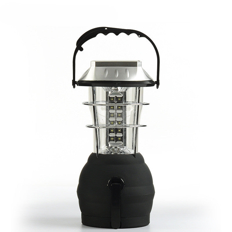 Portable solar camping lantern with hand crank